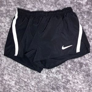 Nike track/athletic shorts, color black, woman’s size small